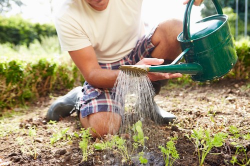 Segregated recycling bins and garden materials at a worksite